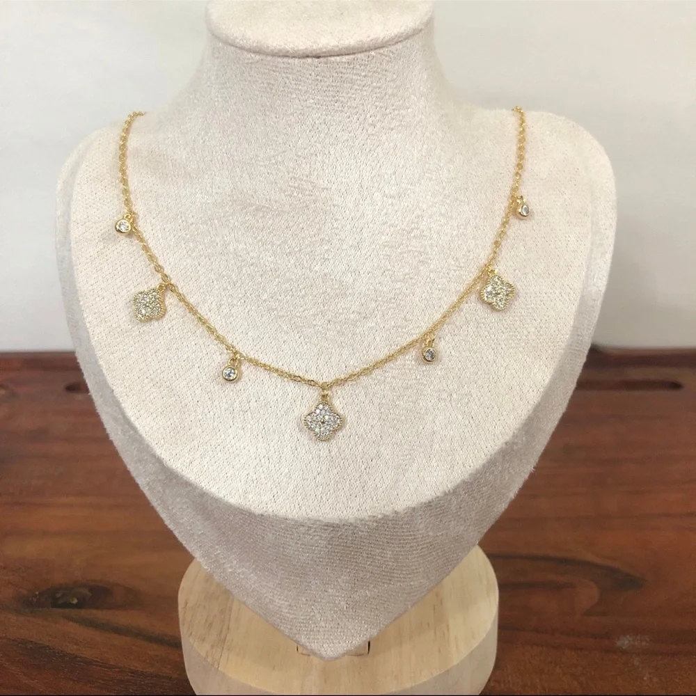 gold dangle station necklace encrusted clover charm round bezel set Cubic Zircon